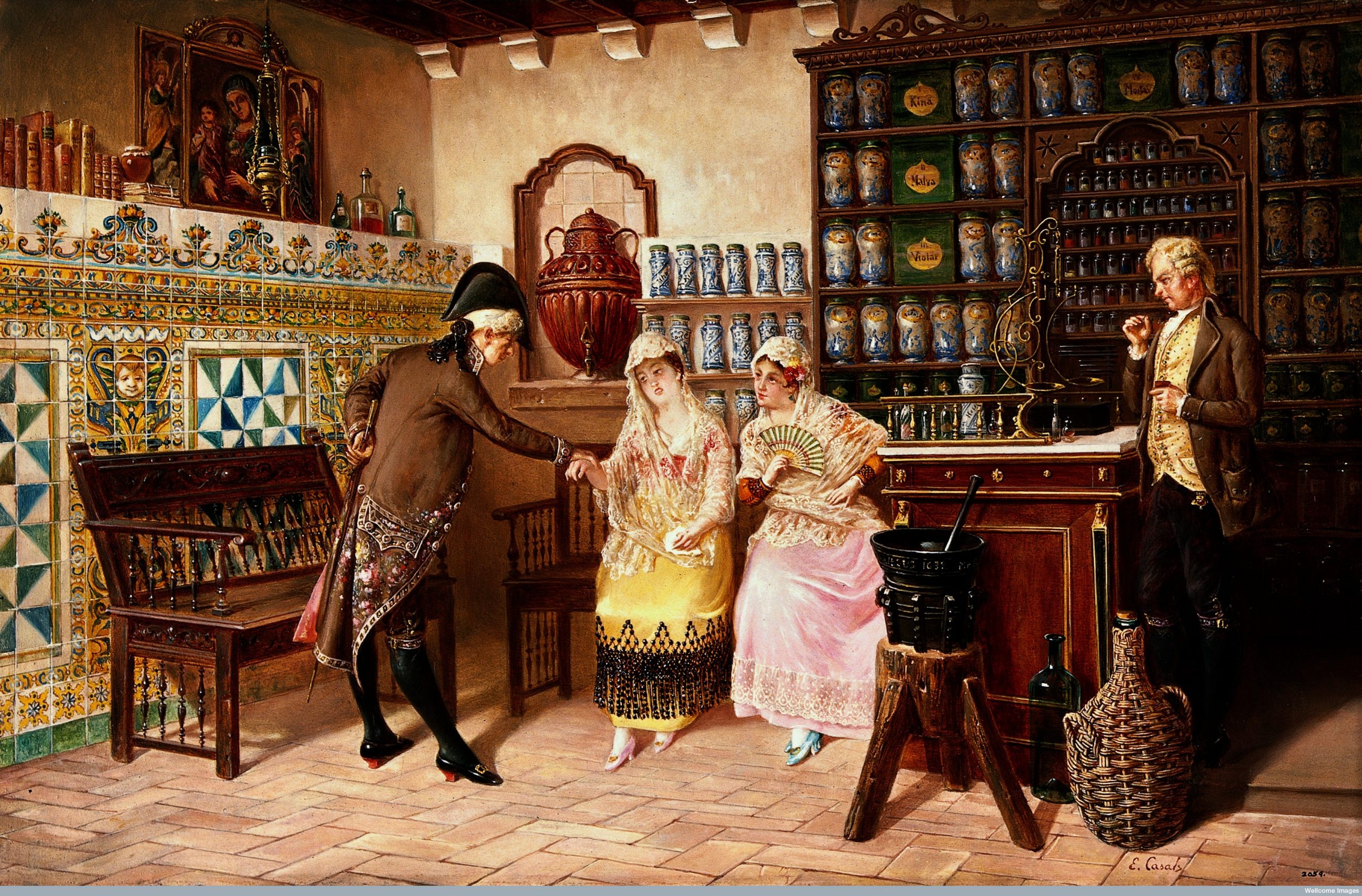 Pintura a óleo Botica Europeia, de Emili Casals i Camps, de 1882. Com duas mulheres e dois homens com roupas de época dentro de uma farmácia. Há armários e prateleiras, com frascos diversos sobre elas.